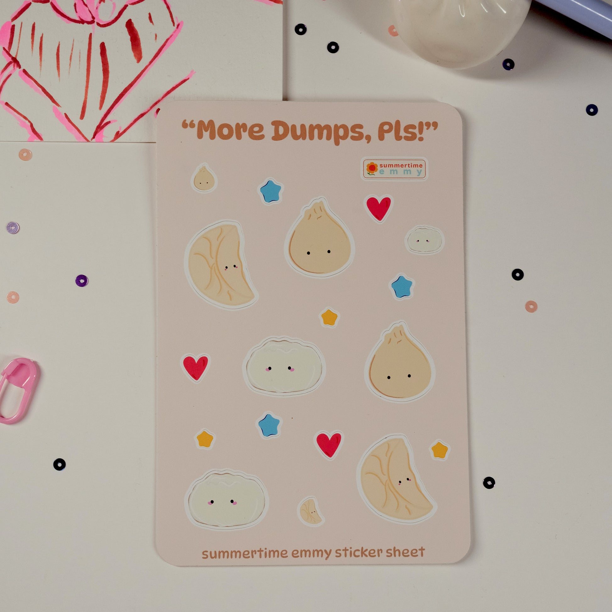 "More Dumps, pls!" sticker sheet displayed with sequins