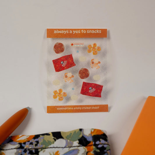 "always a yes to snacks" sticker sheet displayed with pen and bag